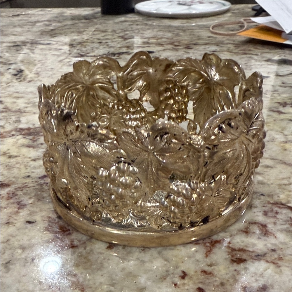 Ornate silver coated wine holder